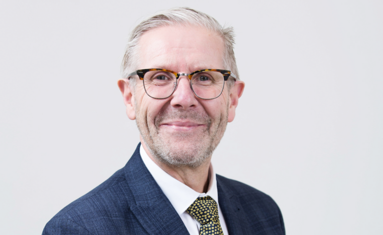 David Jones wearing a suit and tie