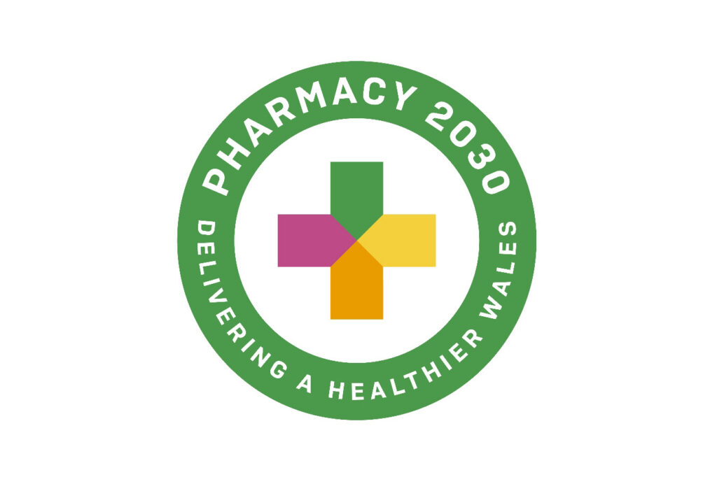 White background, logo with pink yellow orange and green cross with green circle surrounding reading "Pharmacy 2030 Delivering a healthier wales"