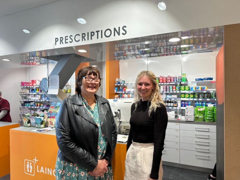 claire anderson with pharmacy team member in front of pharmacy counter