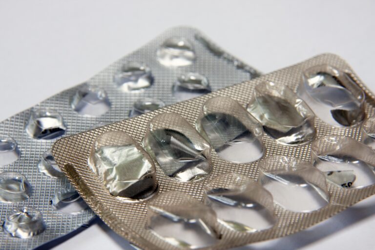 Medicinal pills and capsules in blister packs closeup.