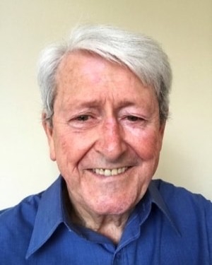 Head and shoulders image of Brian Moon, member of the ‘Pharmacy: Delivering a Healthier Wales’ delivery board, wearing a blue shirt