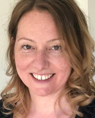 Head and shoulders image of Louise Hughes, member of the ‘Pharmacy: Delivering a Healthier Wales’ delivery board, wearing a black top